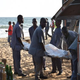 Employees load a body into a van after heavily armed gunmen opened fire in the Ivory Coast resort town of Grand-Bassam March 13, 2016.
SIA KAMBOU/AFP/Getty Images